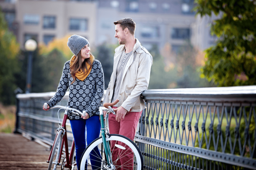 Couple spending time together on bicycles outside