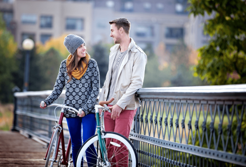 Couple spending time together on bicycles outside