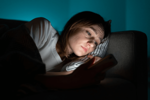 anxious woman lying awake in bed, image for article on denver ketamine for anxiety